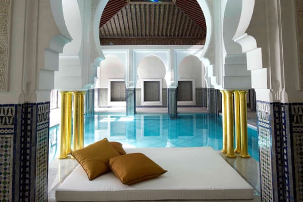 Mamounia Hotel Marrakech with a view of the hotel building and palm trees